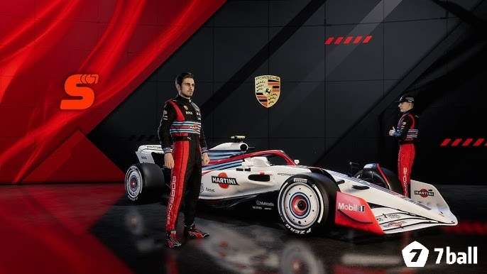 Khu kỹ thuật đội đua với màn hình dữ liệu và xe Formula 1 phía sau